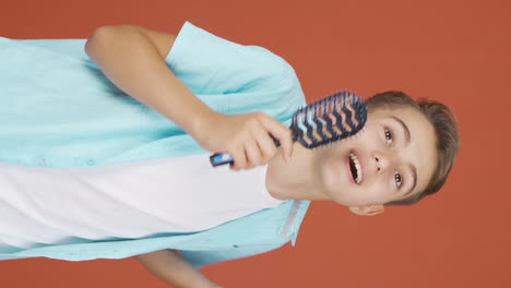 Vertical-video-of-The-boy-is-singing.